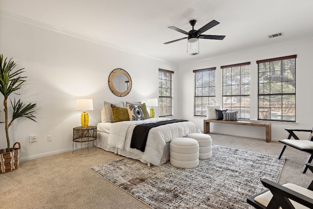 bedroom with carpet, crown molding, baseboards, and visible vents