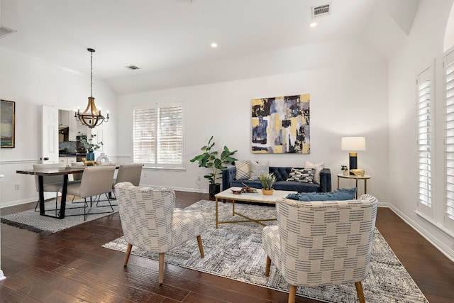 living area featuring a chandelier, visible vents, dark wood finished floors, and lofted ceiling