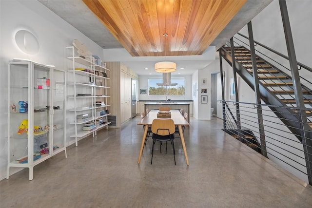 2301 S 5th St Unit 25, Austin, TX 78704 - dining area featuring concrete floors, wood ceiling, and stairs