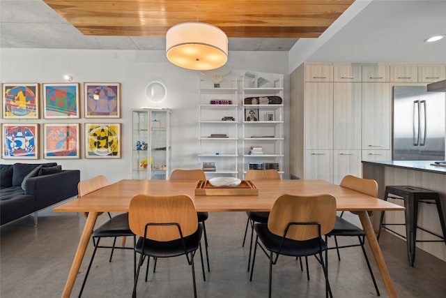 dining room with finished concrete flooring