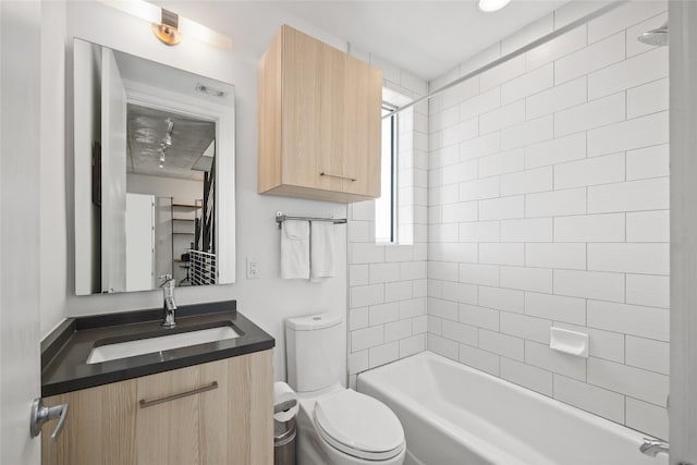 full bathroom featuring tub / shower combination, toilet, and vanity