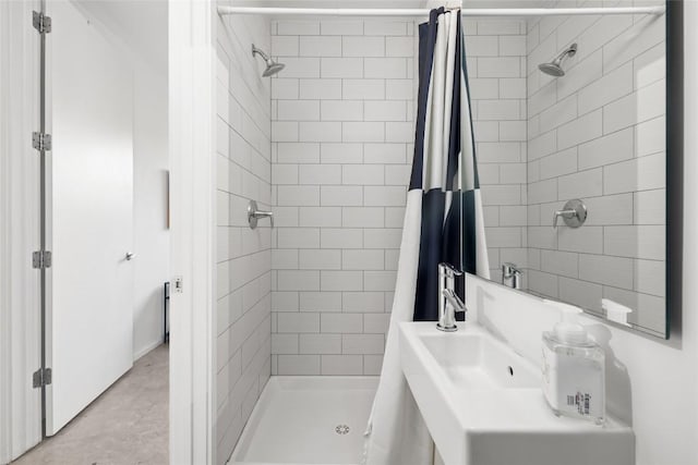 2301 S 5th St Unit 25, Austin, TX 78704 - full bathroom featuring a stall shower and a sink