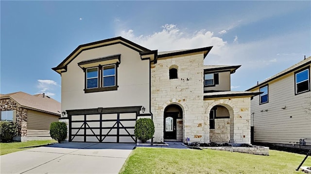 view of front facade with stucco siding, an attached garage, concrete driveway, and a front yard