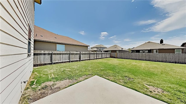 view of yard with a patio and a fenced backyard