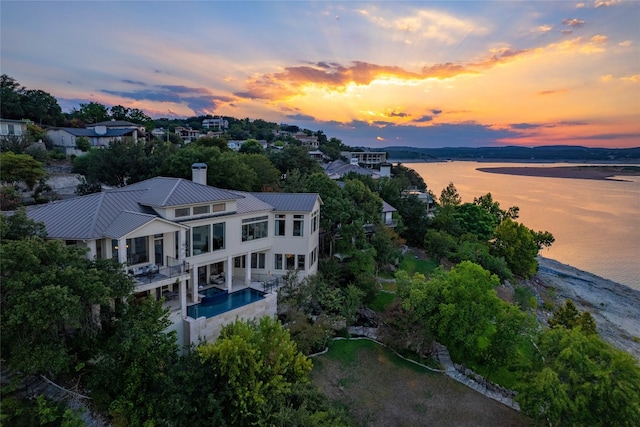 drone / aerial view with a water view