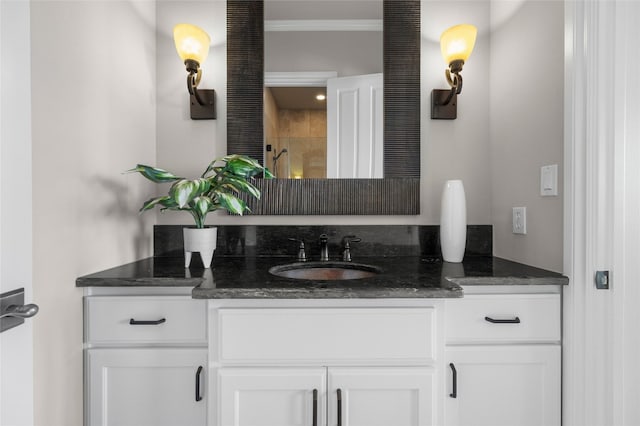 711 Cutlass, Lakeway, TX 78734 - full bathroom with vanity, a tile shower, and crown molding