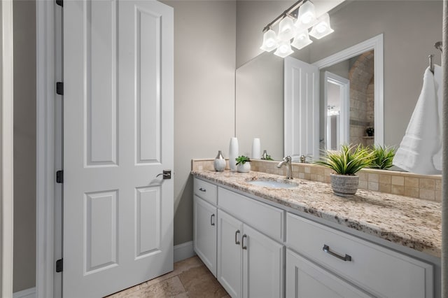 711 Cutlass, Lakeway, TX 78734 - bathroom featuring vanity and decorative backsplash