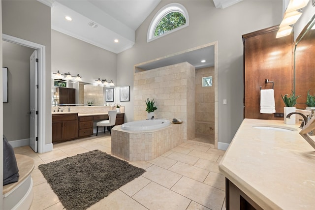 711 Cutlass, Lakeway, TX 78734 - full bathroom featuring a garden tub, two vanities, high vaulted ceiling, tile patterned flooring, and a walk in shower