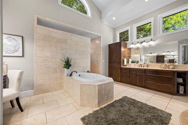 full bathroom with high vaulted ceiling, a bath, vanity, and tile patterned flooring