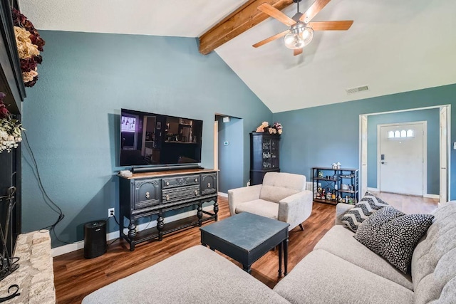 living room with vaulted ceiling with beams, wood finished floors, visible vents, and ceiling fan