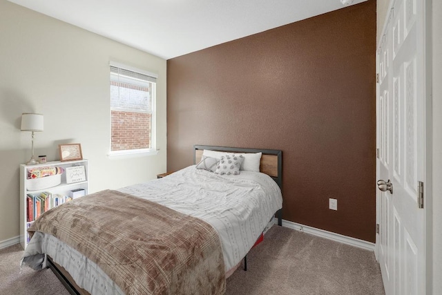 carpeted bedroom with baseboards