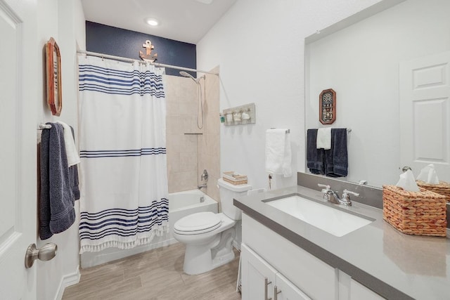 full bath featuring vanity, toilet, shower / tub combo, and wood finished floors