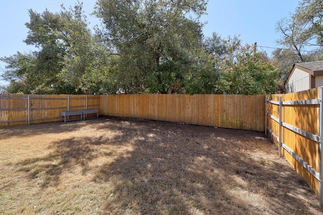 view of yard with a fenced backyard