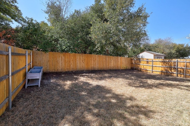 view of yard featuring a fenced backyard