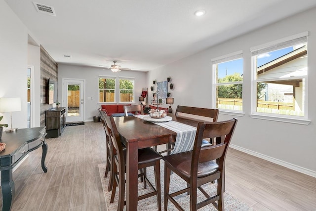 dining area featuring a ceiling fan, baseboards, visible vents, light wood finished floors, and recessed lighting