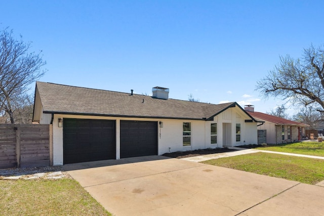 view of front of property with driveway, a front lawn, fence, an attached garage, and brick siding