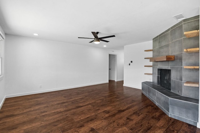 unfurnished living room featuring wood finished floors, baseboards, a fireplace, recessed lighting, and ceiling fan