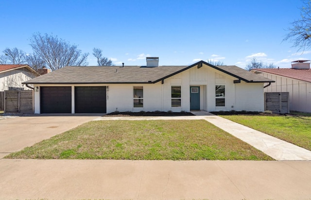 view of front of home with central air condition unit, a front lawn, driveway, an attached garage, and fence