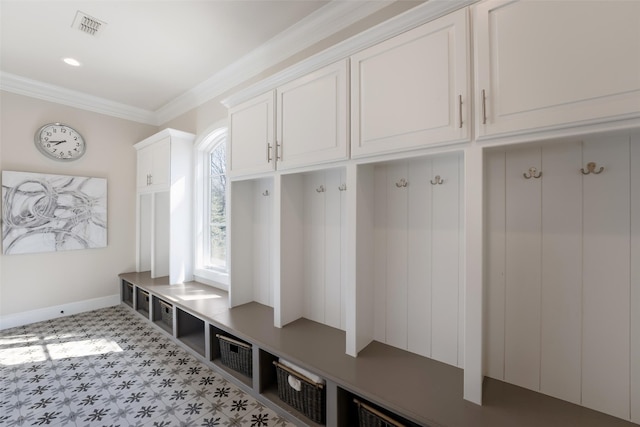 mudroom featuring visible vents, baseboards, and ornamental molding