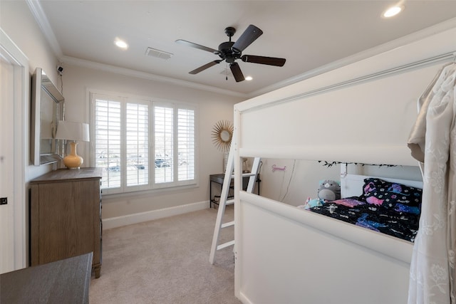 bedroom featuring crown molding, light colored carpet, visible vents, and baseboards