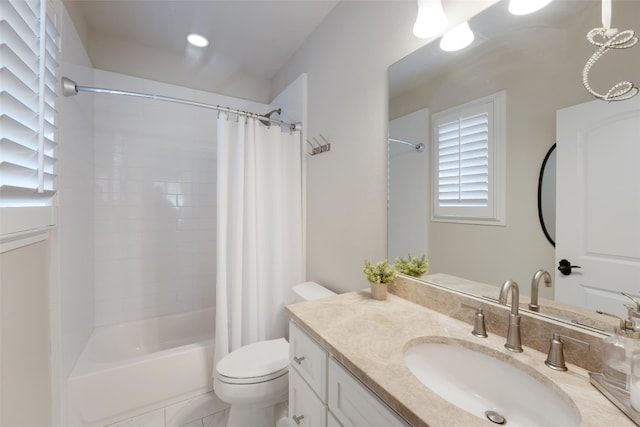 full bathroom with vanity, shower / bath combination with curtain, and toilet