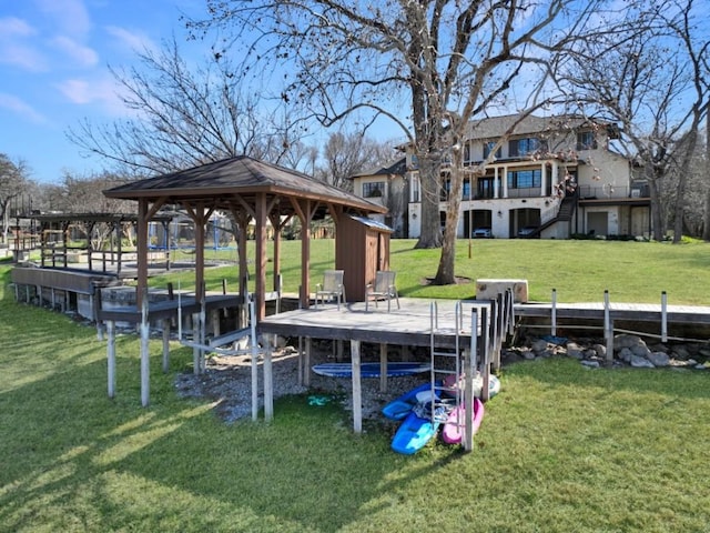 dock area with a yard and a deck