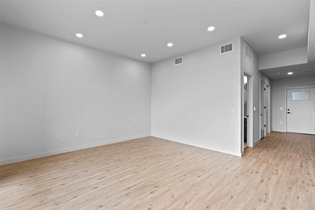 spare room featuring recessed lighting, visible vents, and light wood-style flooring