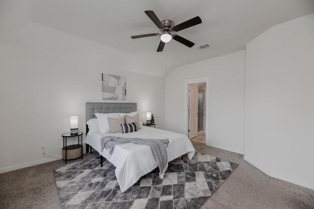 bedroom featuring visible vents, lofted ceiling, carpet, and baseboards