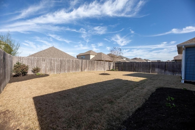 view of yard featuring a fenced backyard