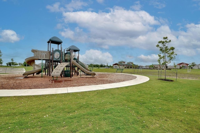 community play area with a lawn