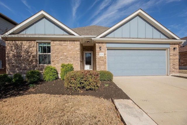 view of front facade with brick siding, board and batten siding, concrete driveway, and an attached garage