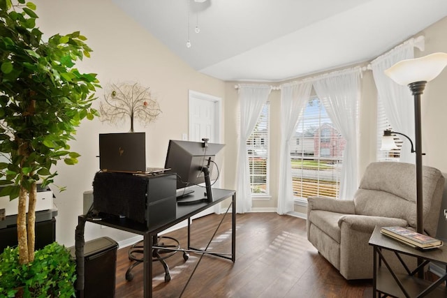 home office featuring dark wood-style floors and lofted ceiling