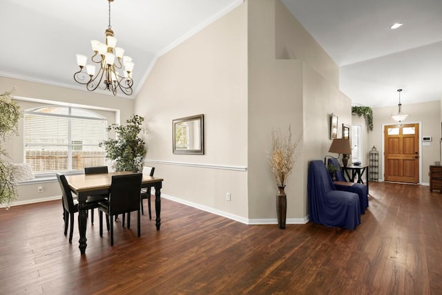 dining room featuring high vaulted ceiling, hardwood / wood-style flooring, an inviting chandelier, crown molding, and baseboards