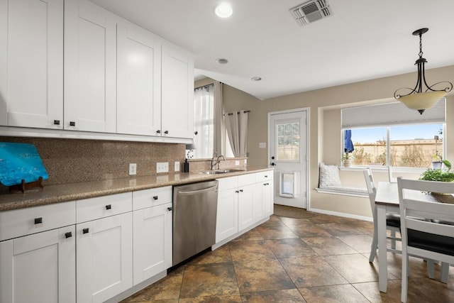 kitchen with a sink, tasteful backsplash, dishwasher, and white cabinetry