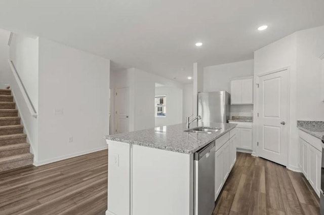 1424 Morris Loop, San Marcos, TX 78666 - kitchen with stainless steel appliances, a sink, dark wood-type flooring, a kitchen island with sink, and recessed lighting
