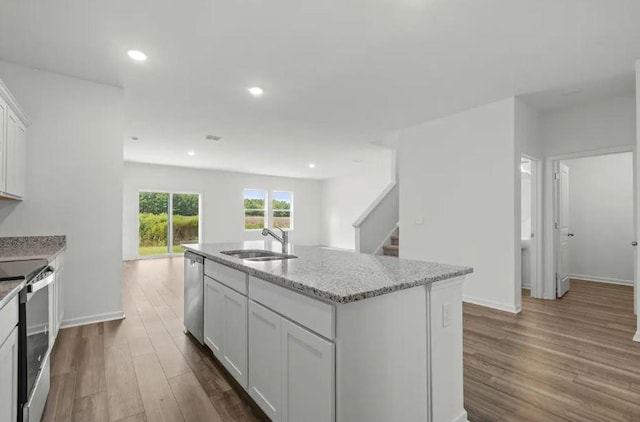 1424 Morris Loop, San Marcos, TX 78666 - kitchen featuring dishwasher, electric range, a sink, dark wood-style flooring, and white cabinetry