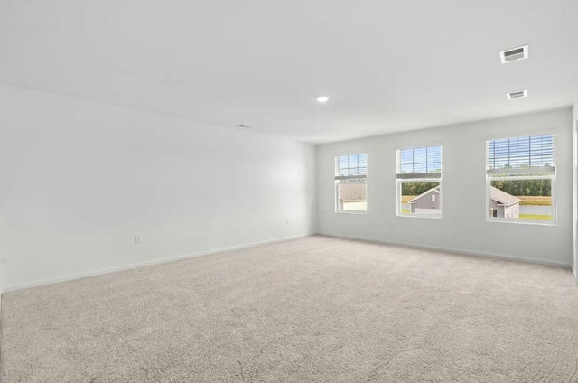 1424 Morris Loop, San Marcos, TX 78666 - carpeted empty room with plenty of natural light, baseboards, and recessed lighting
