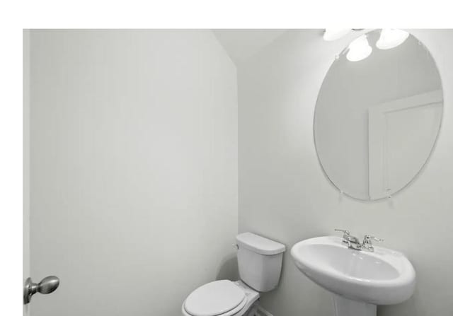 1424 Morris Loop, San Marcos, TX 78666 - bathroom featuring toilet and a sink