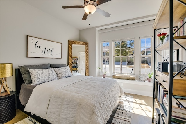 bedroom featuring a ceiling fan and wood finished floors