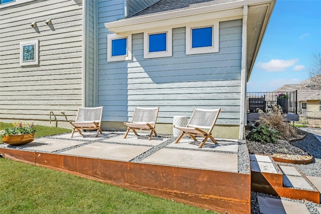 view of patio / terrace featuring fence