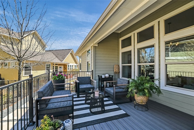 wooden deck with an outdoor living space