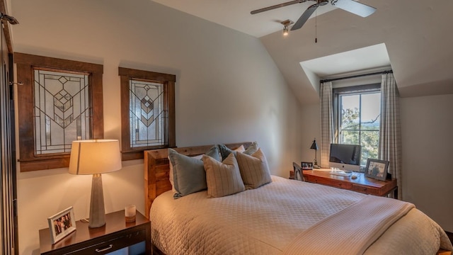 bedroom with a ceiling fan and vaulted ceiling