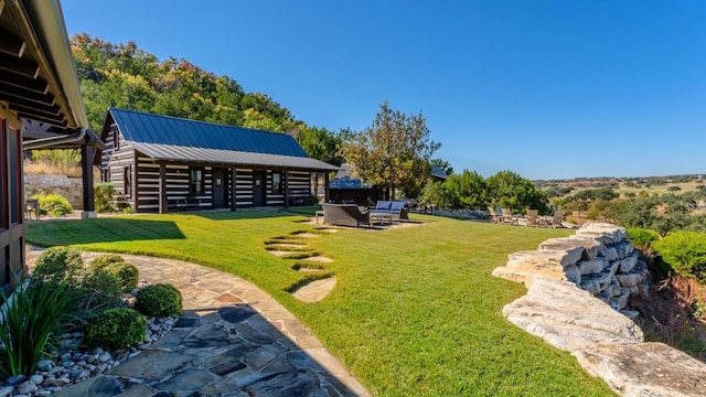 view of yard featuring a patio and an outdoor structure