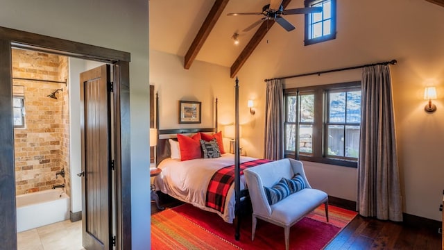 bedroom with beam ceiling, multiple windows, high vaulted ceiling, and wood finished floors