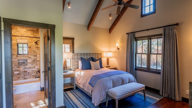 bedroom with beamed ceiling and high vaulted ceiling