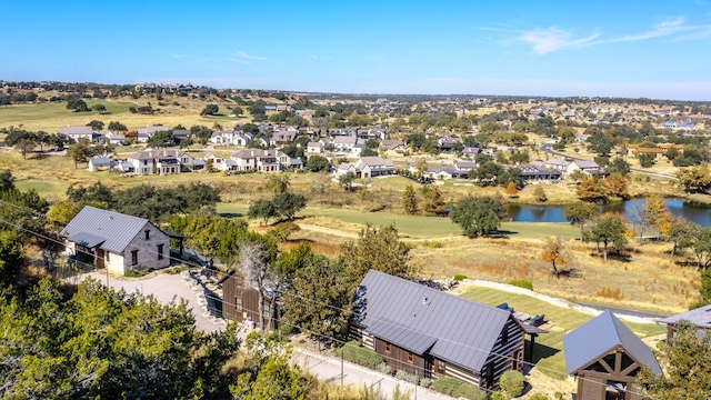 bird's eye view with a water view and a residential view