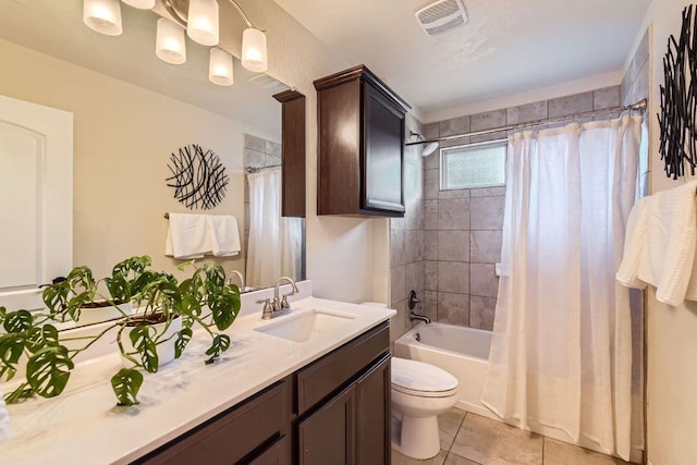 full bath with visible vents, toilet, shower / bath combo, tile patterned floors, and vanity