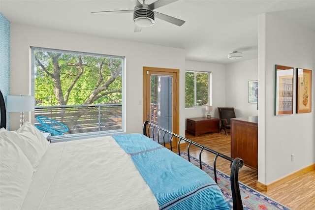 bedroom featuring wood finished floors, baseboards, and ceiling fan