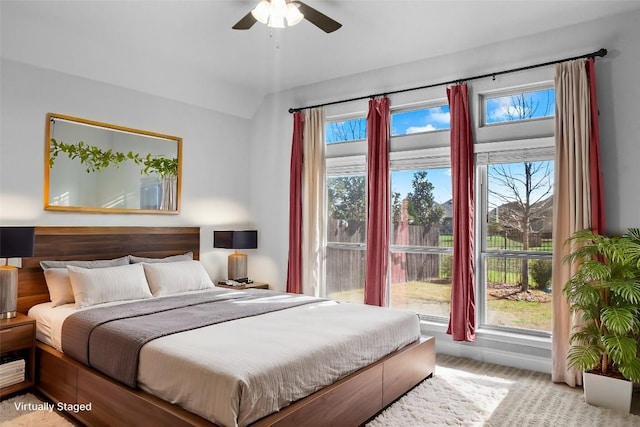 carpeted bedroom with a ceiling fan