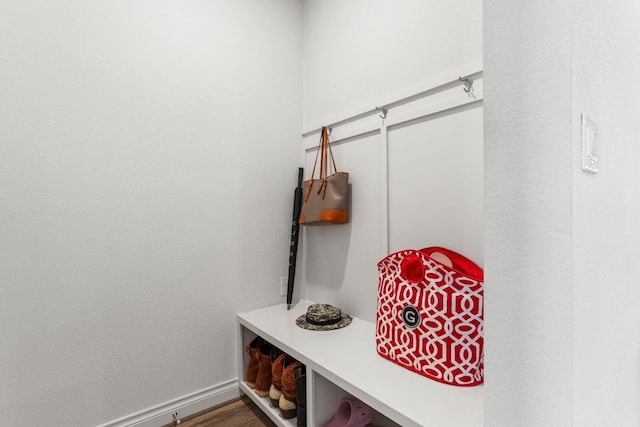 mudroom featuring baseboards and wood finished floors